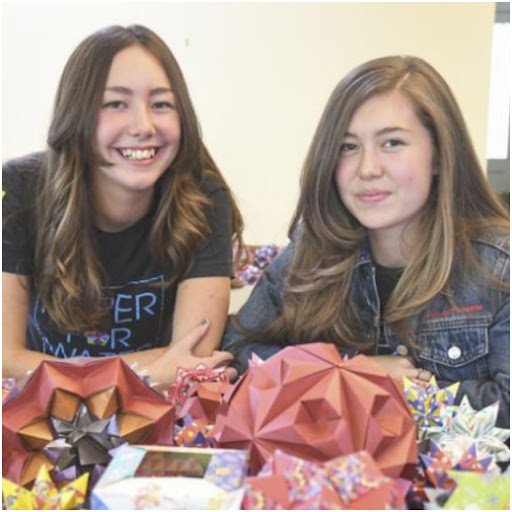 Isabelle and Katherine Adams with their origami