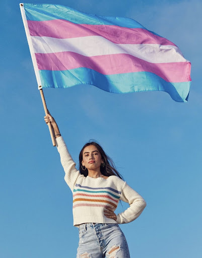 Logan with the transgender flag