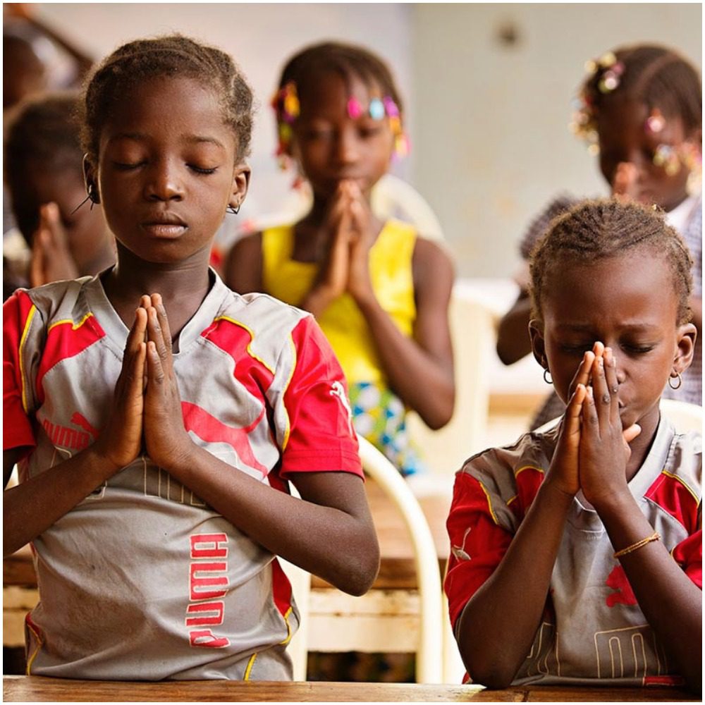 Christian children praying
