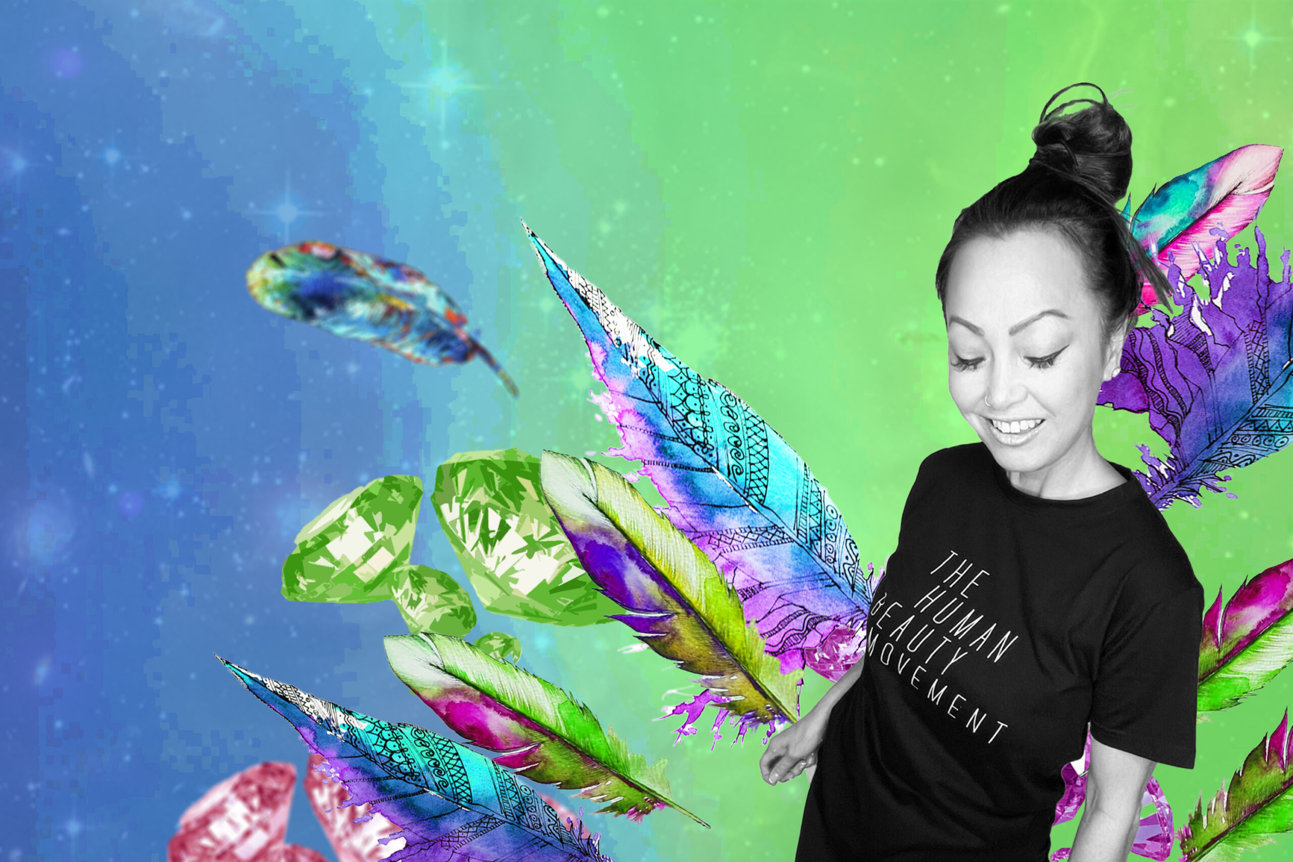 Founder Jennifer Norman in a black HBM tee with her hair in a messy bun smiling against a virtual backgrop of fethers, crystals, and blue-green gradient